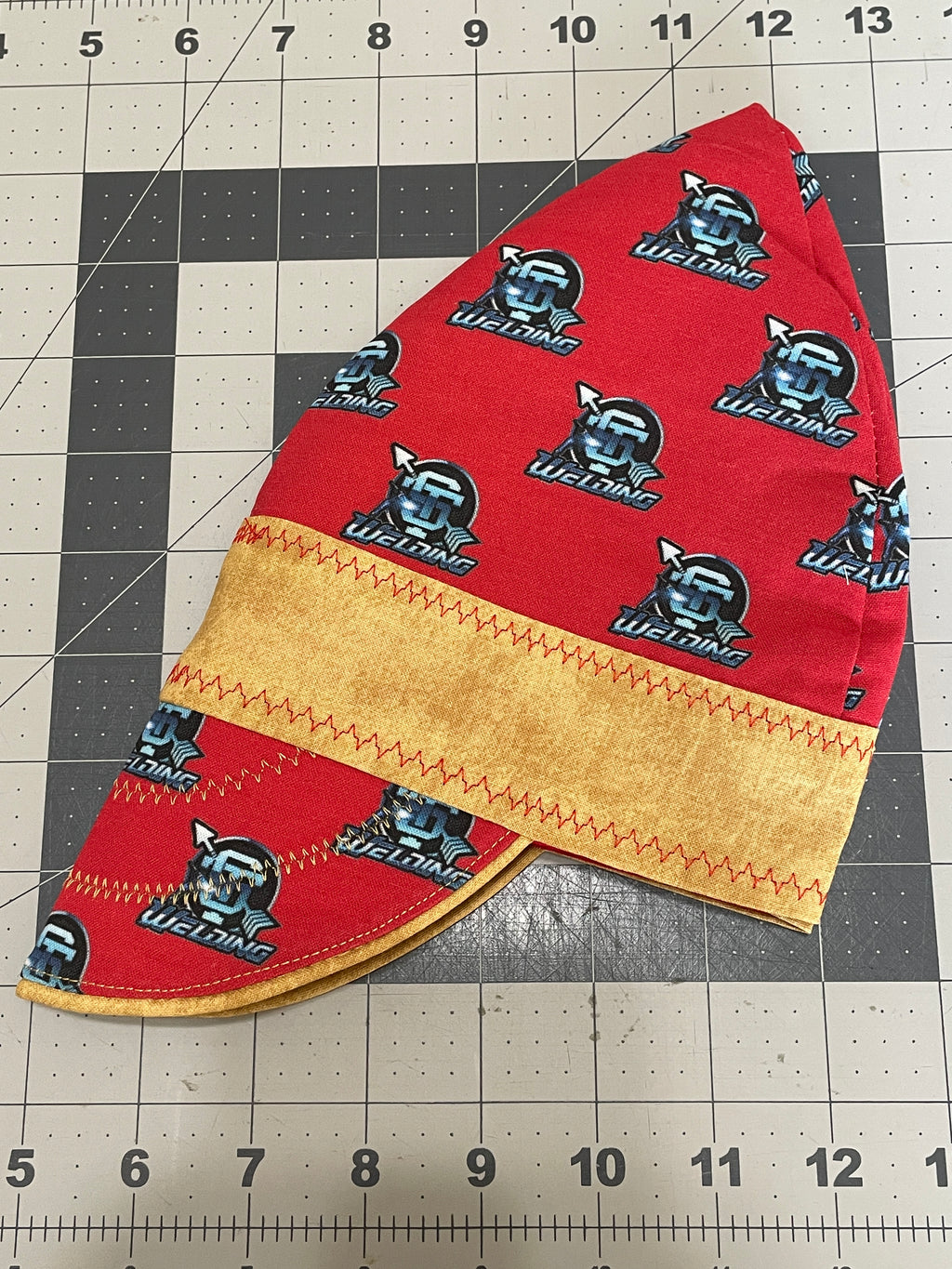 Handcrafted custom welding cap made from high-quality cotton, designed to fit under a welding helmet
