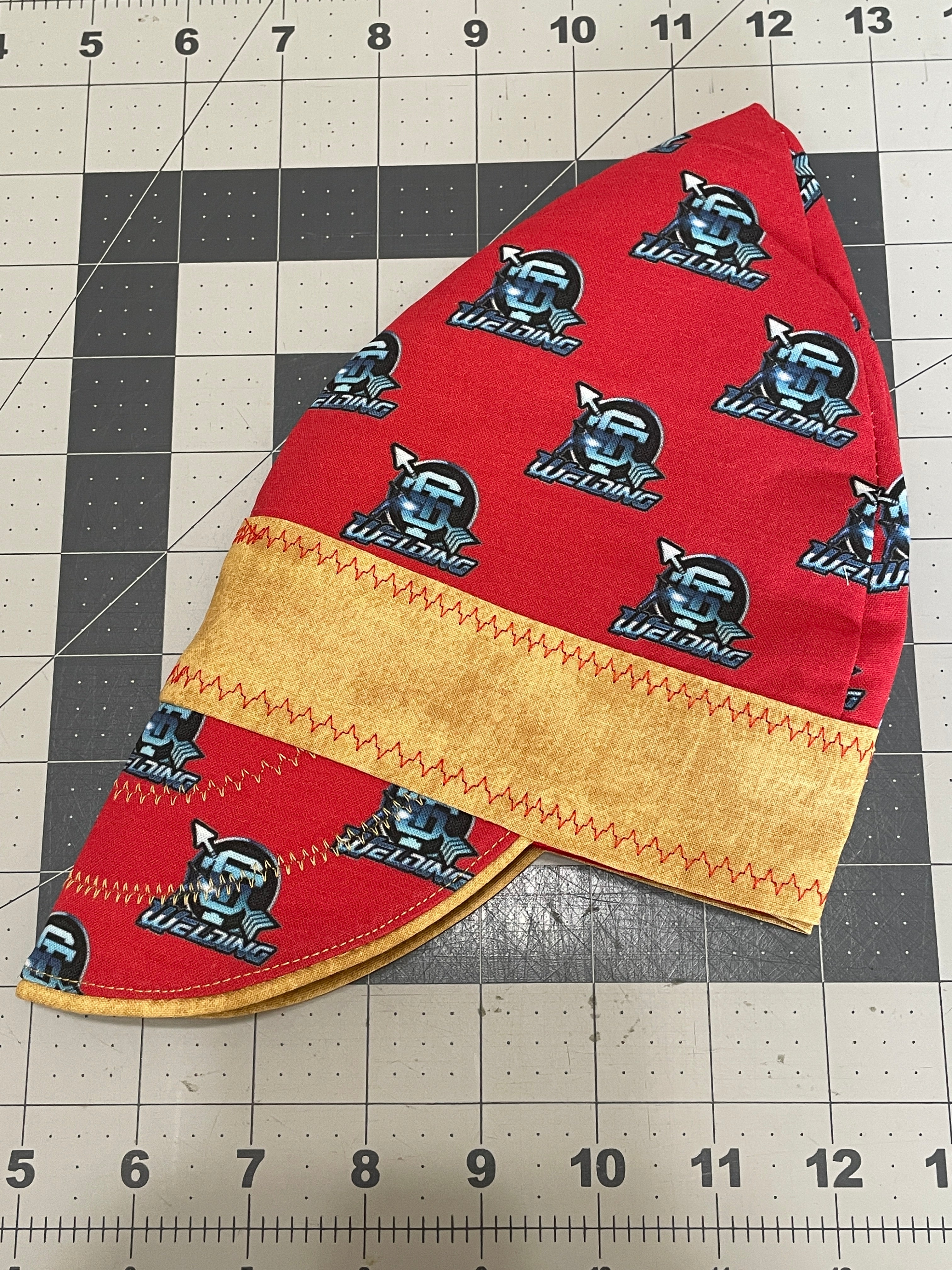 Handcrafted custom welding cap made from high-quality cotton, designed to fit under a welding helmet
